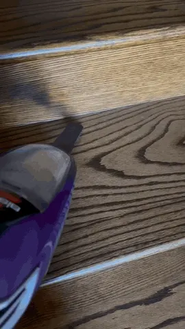 The crevice tool reaches the gaps a floor head cannot, and the seam gives up its debris.