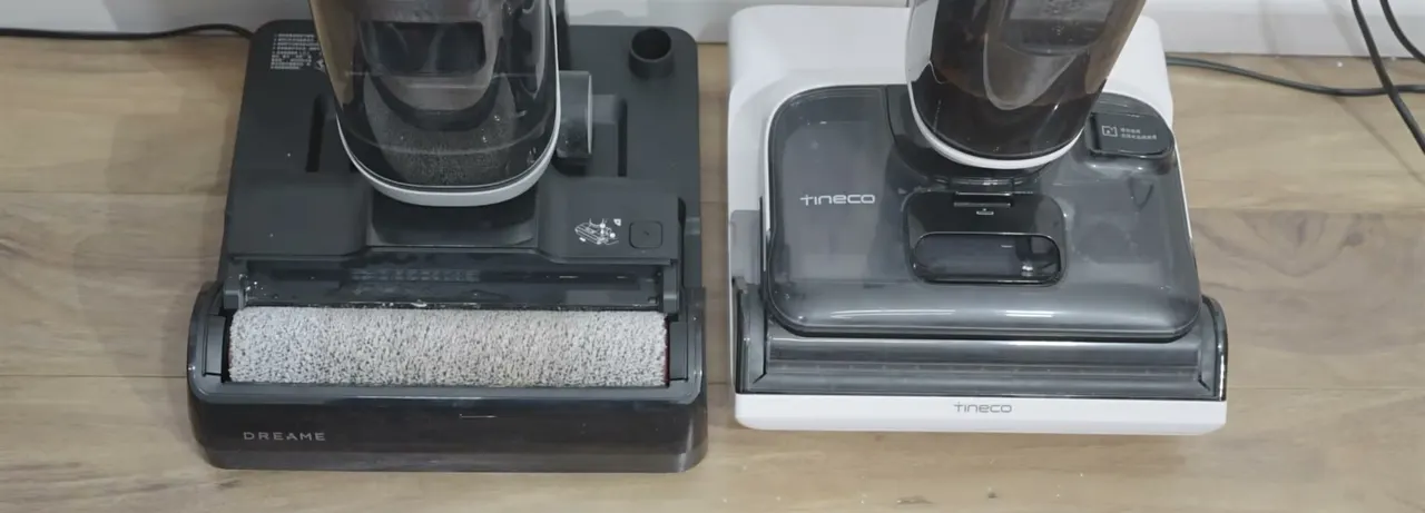 Rollers seated for the heated wash: the black Dreame dock on the left, a white Tineco dock on the right.