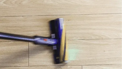 Pickup is decided in one slow pass: the debris piles wait directly in the nozzle's path.