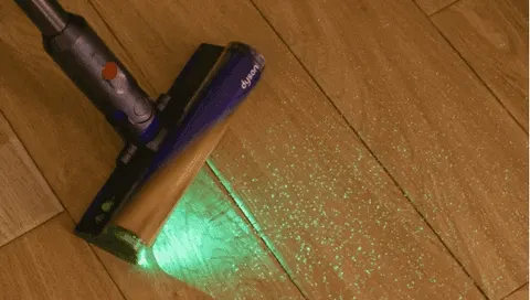 The green fan reveals dust that room lighting hides.
