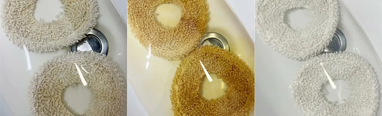 The dock wash is why pads come out visibly clean: soiled on the left, stained mid-wash in the middle, rinsed on the right.