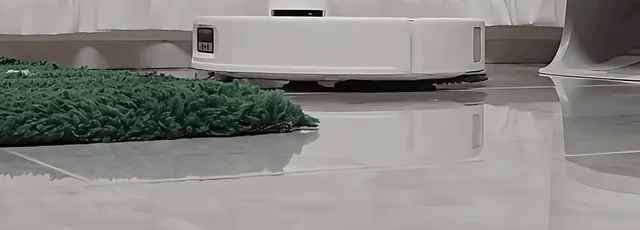 It climbs onto thick rugs, but high-pile carpet is where this robot's cleaning limits show.